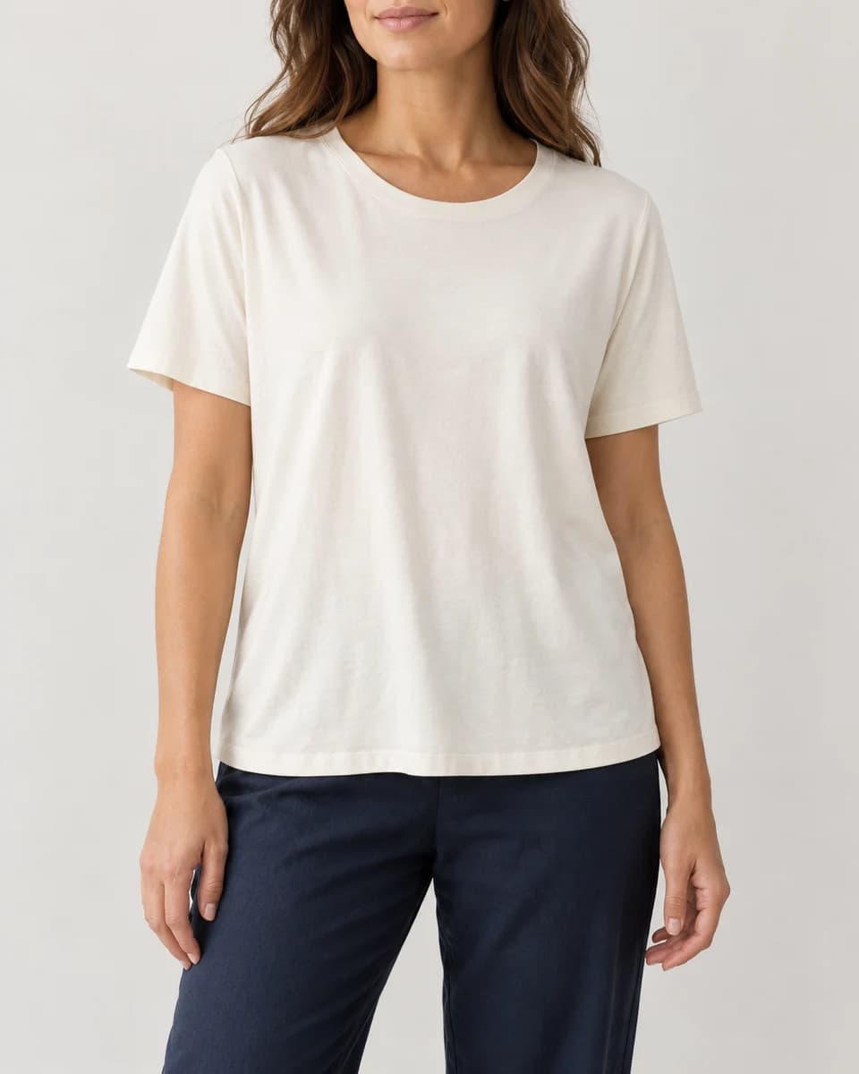 Generated category example of a woman in a loose ivory short-sleeve crew-neck tee; not the Solbari product