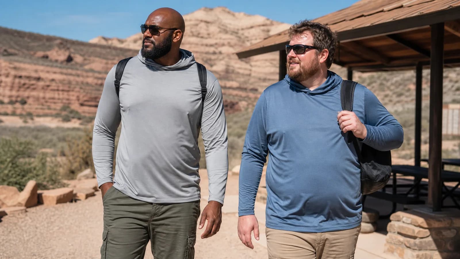 Big and tall hiker wearing a relaxed lightweight sun hoodie on an open trail
